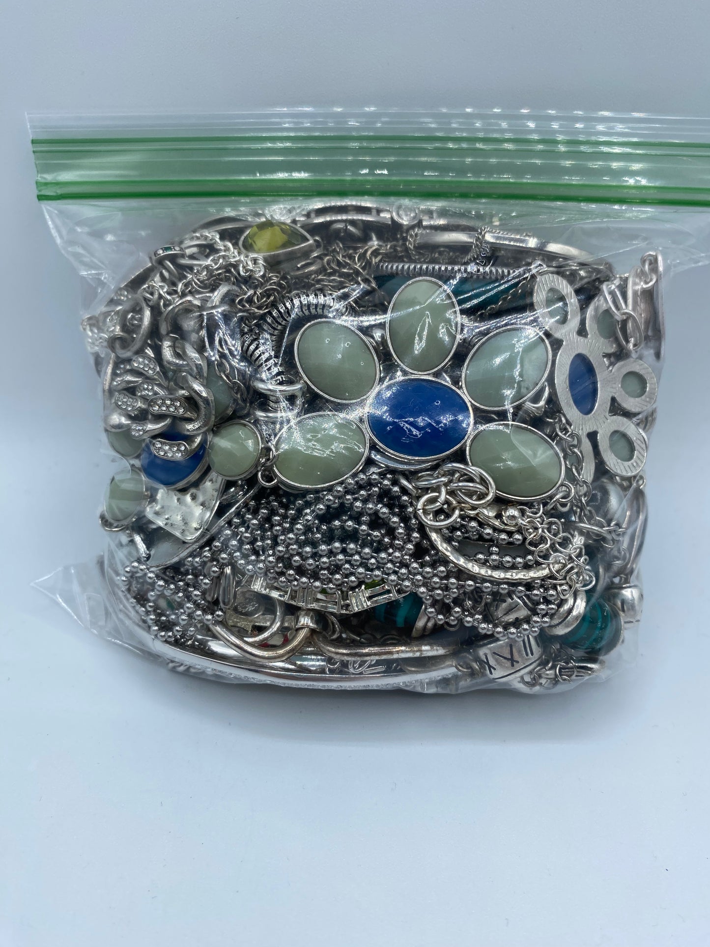 Small Silver Tone Mystery Jewelry Bag #4